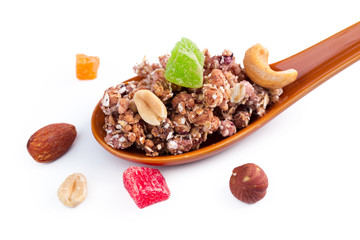 Photo of Full spoon of granola isolated on white background