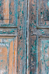Old paint layers from different epochs on Venetian doors