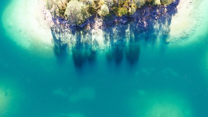 aerial drone view of the beautiful Lake Eibsee at the base of the Zugspitze mountain in the...