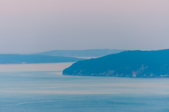 Crec and Krk islands on Adriatic sea bay at sunset