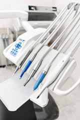 Stomatological instrument in the dentists clinic. Dental work in clinic. Operation, tooth replacement. Medicine, health, stomatology concept. Office where dentist conducts inspection and concludes.
