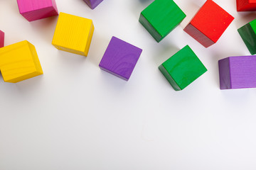 Fototapeta na wymiar Colorful wooden building blocks isolated on white background