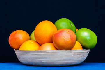 Plate full of Citruses fruits. Oranges, grapefruits.