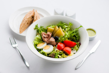 Decorated food. Tuna salad with sauce and bread