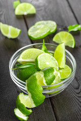 Fresh limes on wooden table