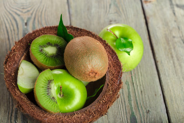 Juicy kiwi fruit on wooden table