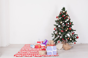 Christmas tree in white interior with toy decor