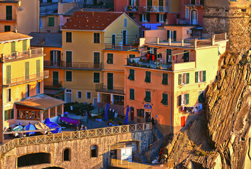 Fototapeta premium colorful houses, tourists and old facade in small village Manarola Cinque terre in liguria, italy