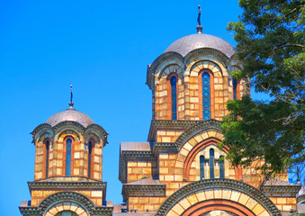 Crkva Svetog Marka (Saint Mark's Church) in Belgrade, Serbia . Serbian Orthodox church facade and dome located in the Tasmajdan park in Beograd                                         - obrazy, fototapety, plakaty
