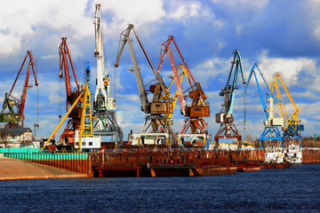 Old harbor cargo cranes. Shipping equipment. Container terminal in the port