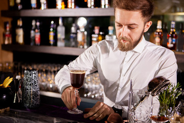 Barman making alcohol coffe drink.Pouring drink