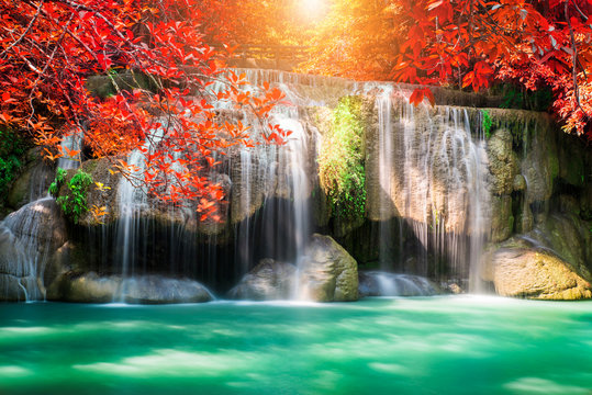 Fototapeta Amazing in nature, wonderful waterfall at autumn forest in fall season. 