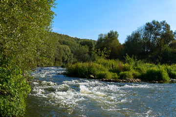 The Ilyushinskiy threshold for the rough river Osetr
