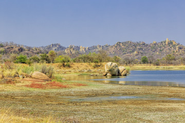 View of a lake surrounded by rocks, in Matobo National Park, Zimbabwe, Africa.