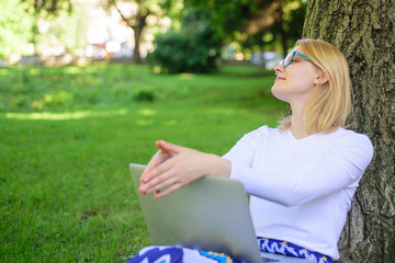 Woman laptop park study online. Girl sit grass with notebook. Girl take advantage virtual...