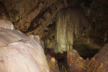 Underground caves of Abkhazia. Stalactites and stalagmites in the dark.