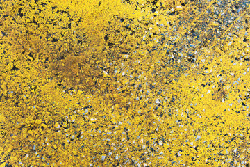 Yellow markings on surface of asphalt road