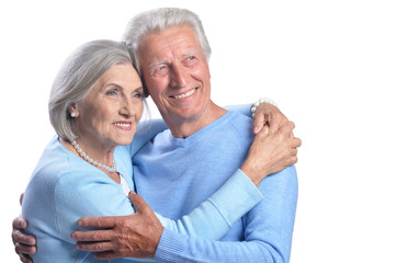 Portrait of happy senior couple on white background