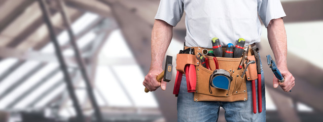 Building worker with tool belt