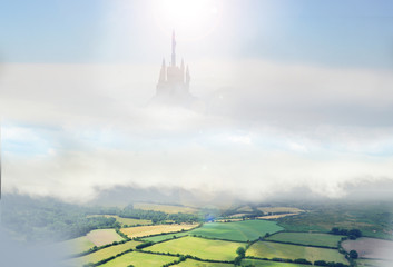 giant castle in sky above countryside, © stuart