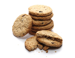 Round wholewheat biscuits, cookies with raisins isolated on white background