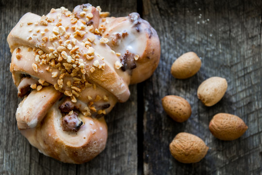 polish traditional Saint Martin's croissants rogal swietomarcinski and fresh almonds in shell on wooden background