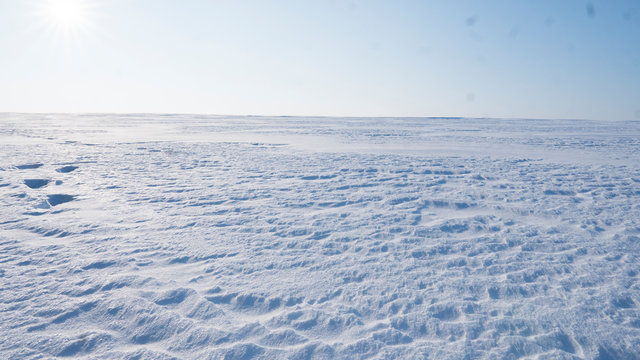A Field covered with a snow in winter season. Winter countryside landscape.