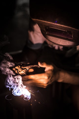 a man are metalworker welding with steel
