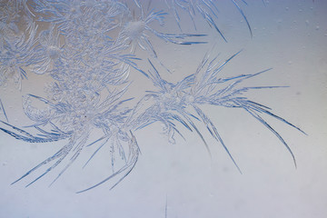 Snow patterns on glass as an abstract background