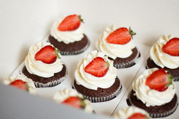 Cupcakes with strawberries and cream