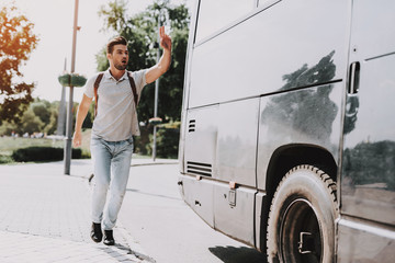 Young Handsome Tourist almost Late for Bus