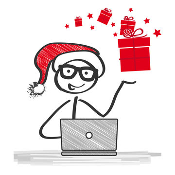 Strichm&auml;nnchen mit Weihnachtsm&uuml;tze und Geschenkpaket bestellt online am Laptop Weihnachtsgeschenke