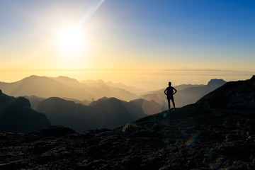 Woman hiking success silhouette in mountains sunset - 230599625