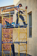 Builder at the finish house working with the tool.