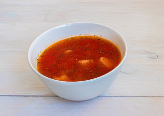 Ukrainian borsch on white background. red soup with beets  with sour cream on a Ukrainian towel