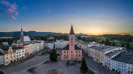 Panorama of Radków main square and Sudety mountains aerial view - obrazy, fototapety, plakaty