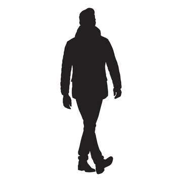 Business man walking forward in winter clothing, isolated vector silhouette