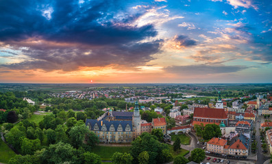 Oleśnica castle with city panorama at the sunset aerial view
