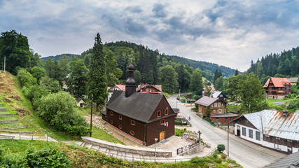 Fototapeta na wymiar Wooden church in Międzygórze aerial view