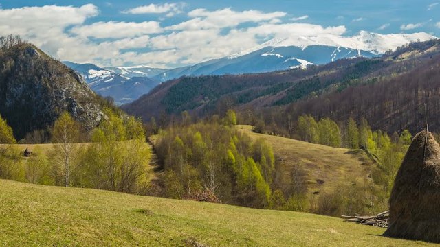 Countryside landscape with blue sky and clear field, near Petrosani city, Romania.