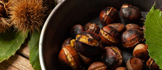 Roasted chestnuts in iron skillet