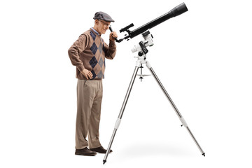 Elderly man looking through a telescope