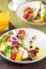Chisken breast and mushroom salad with vegetables