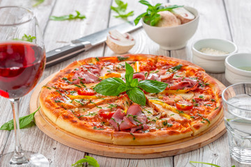 Delicious fresh pizza served on wooden table