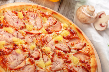 Delicious fresh pizza served on wooden table