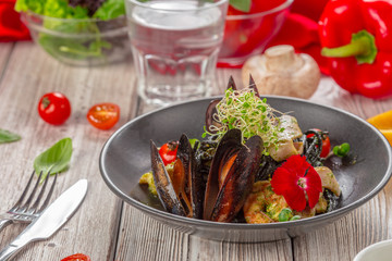 Grilled seafood salad on wooden table