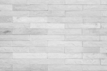 Seamless Grey pattern of decorative brick sandstone wall surface with concrete of modern style design decorative uneven have cracked realmasonry wall of multicolored stones or blocks with cement.
