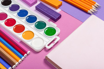 Naklejka premium school supplies at abstract colorful background texture