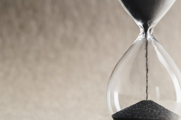 Close up hourglass on table