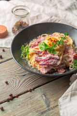 Pasta Carbonara. Spaghetti with bacon, parsel and parmesan cheese